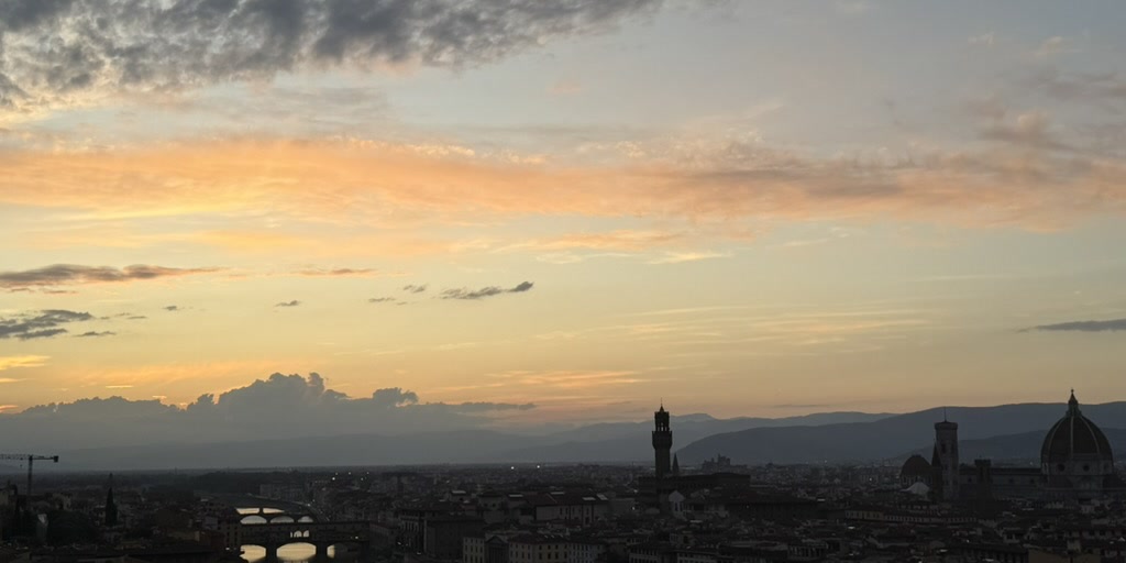 Florence, Italy at sunset with the Duomo and Arno River skyline