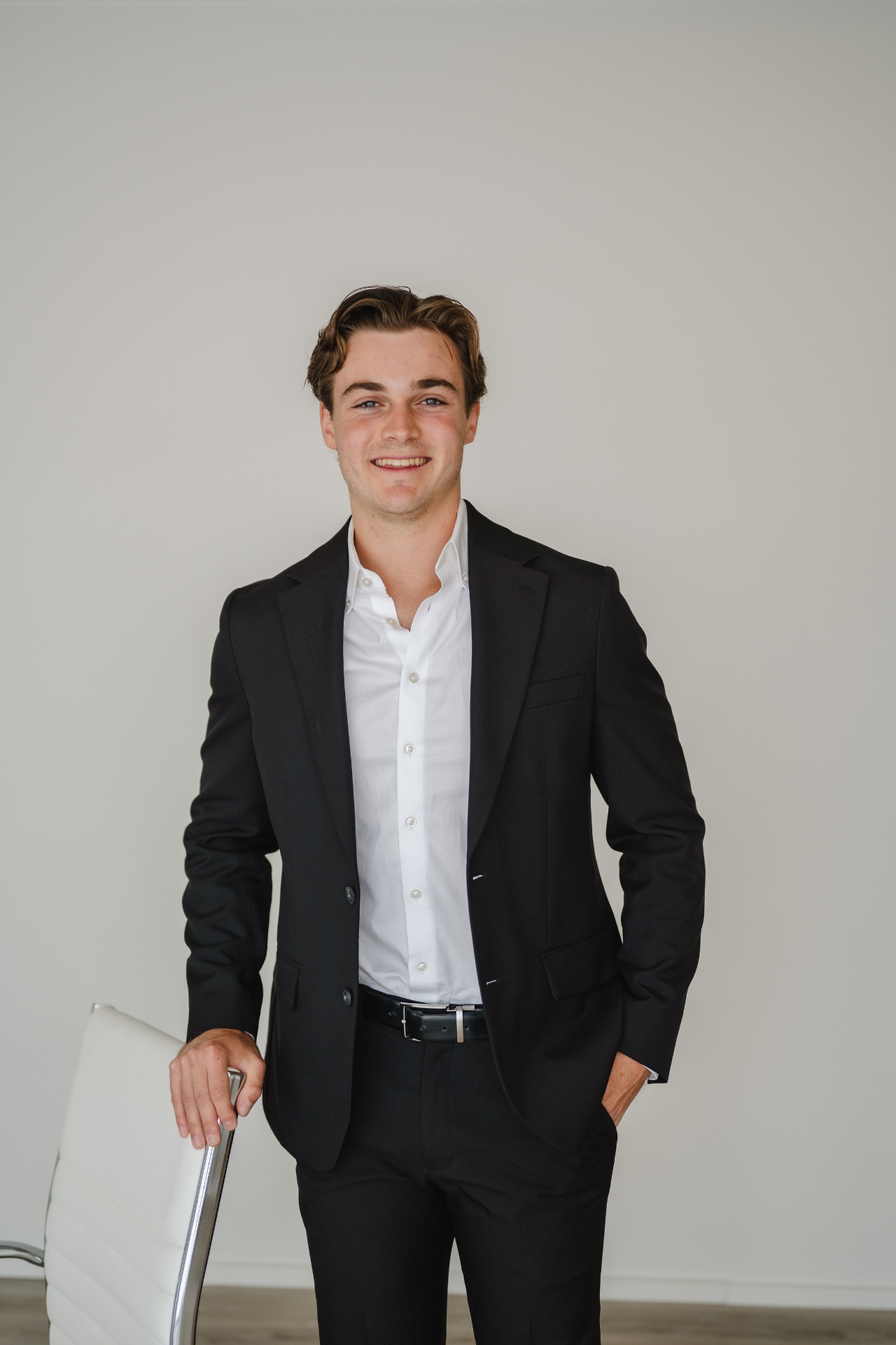 Hunter Smith leaning on a chair
